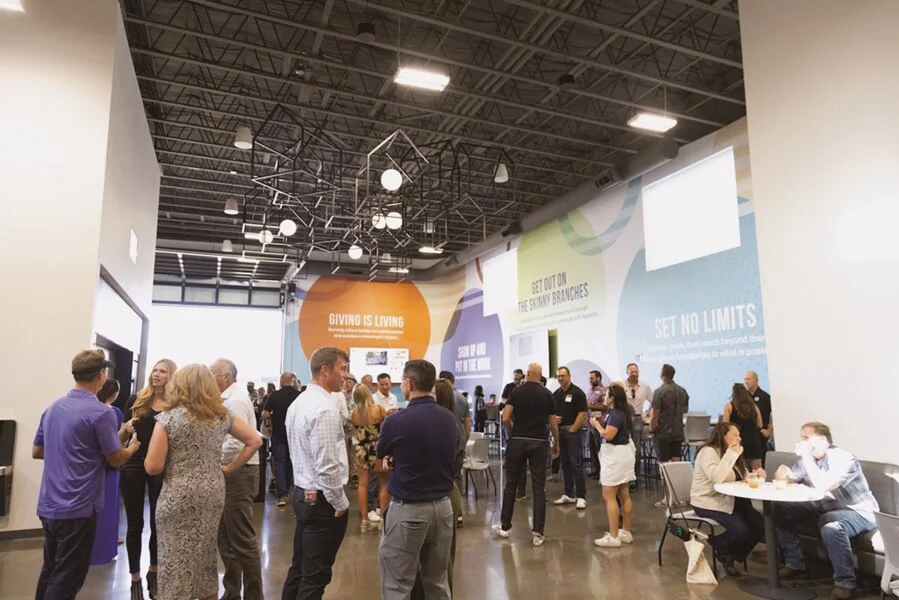 An image of people congregating around wall graphics and murals.